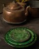 Tre gröna Tamegroute tallrikar av keramik
